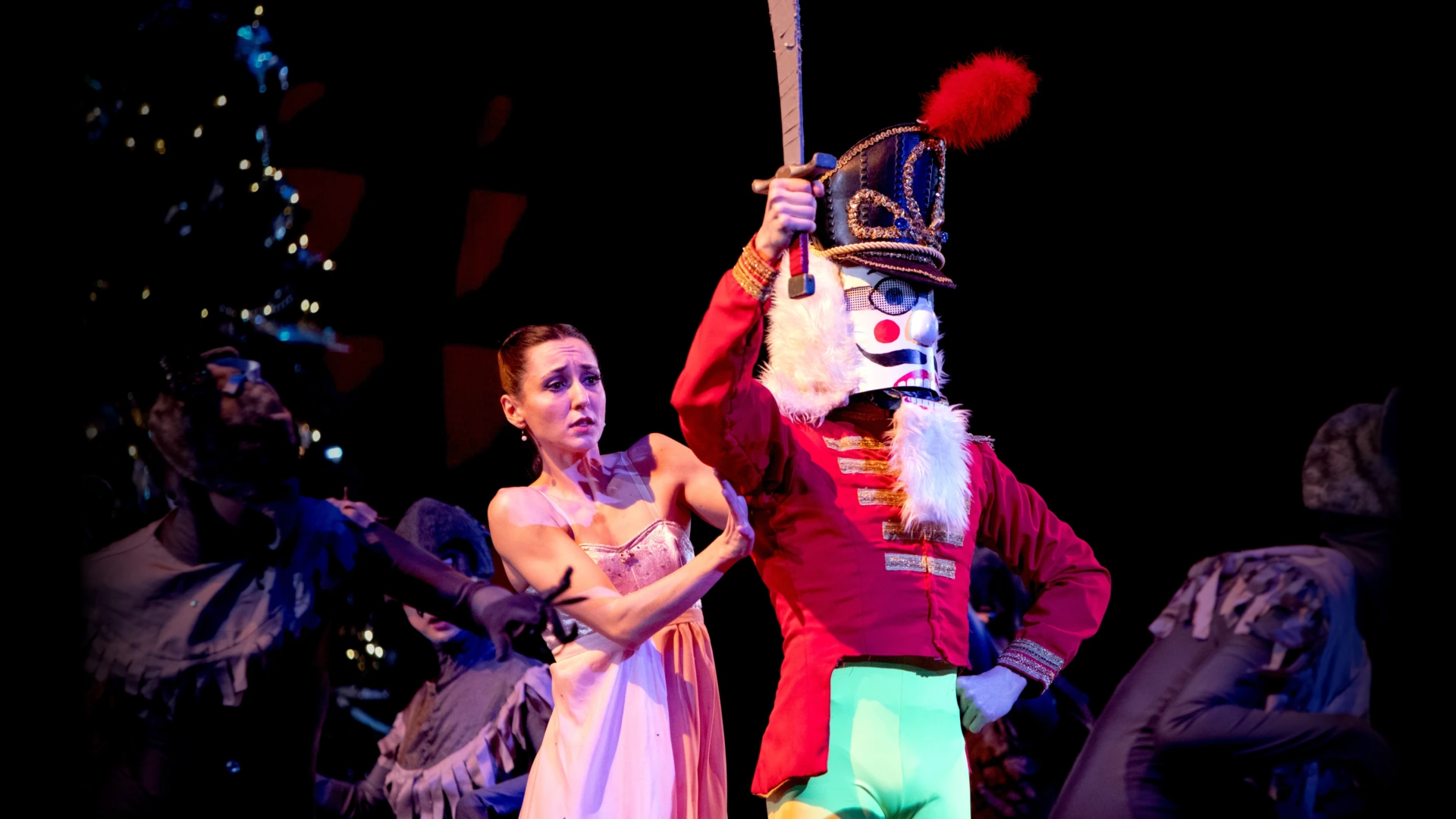 Clara in the midst of a magical battle between a horde of giant mice led by the Mouse King and an army of toy soldiers led by the Nutcracker Prince in City Ballet of San Diego's production of "The Nutcracker"